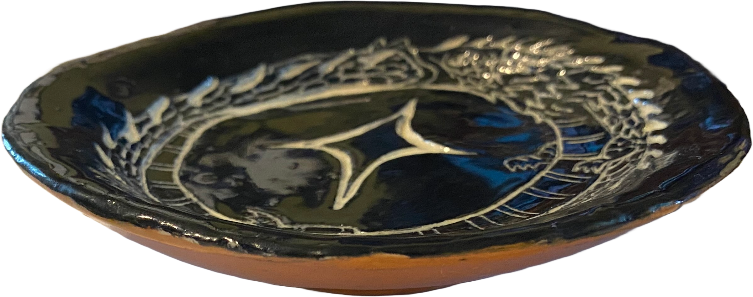 Side-view of the above dish, showing the orange bottom and shallow depth